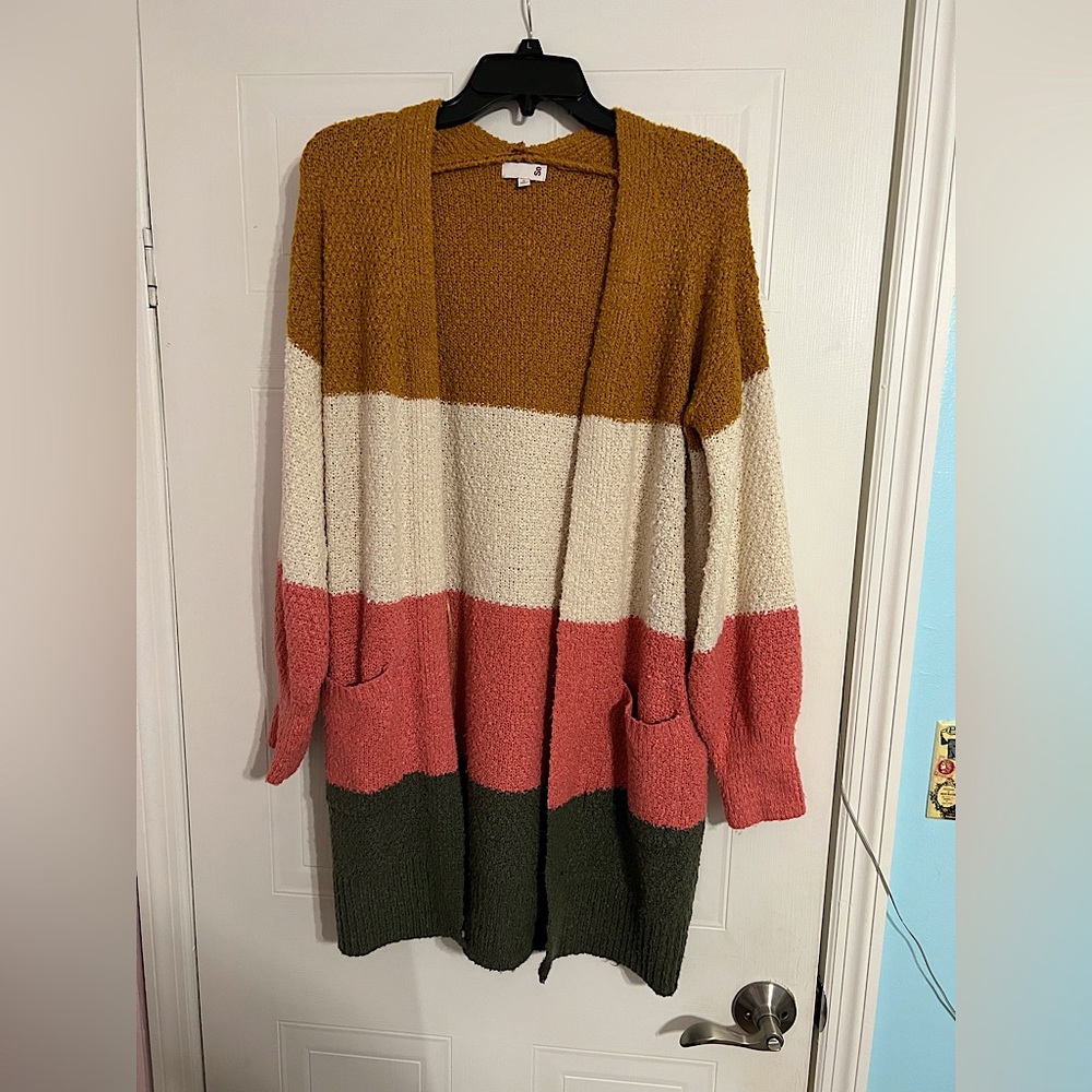 A soft, warm, long, multicolored cardigan. perfect for fall weather